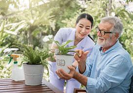 A person gradually returning to gardening one small step at a time, rebuilding confidence and function through graded exposure.