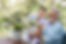 Caregiver helping a senior with plants