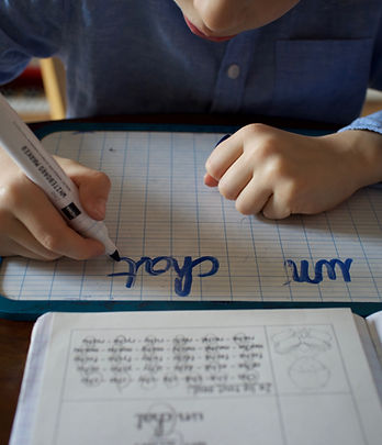 This is a student who is learning to read and write.