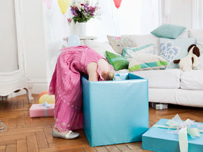Child looking inside big box