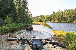 ATVs Crossing Stream