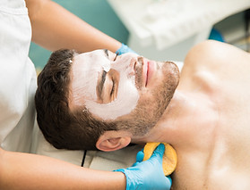 Man receiving facial treatment