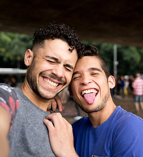 Young people smiling at the camera at a nonprofit event