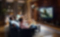 A group of young male friends are shocked while watching Soccer game on TV. They