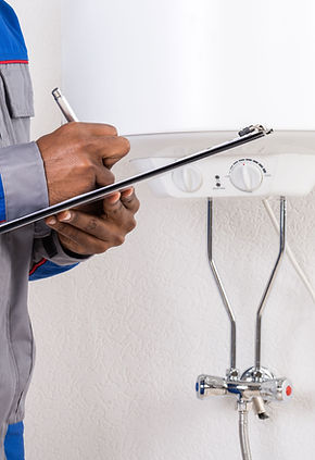 Technician Inspecting Boiler