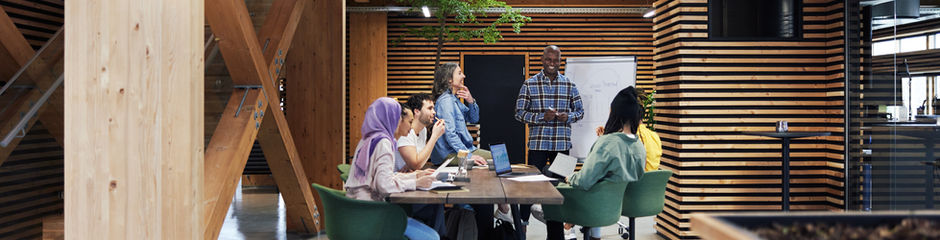 A group of individuals sitting around a table talking