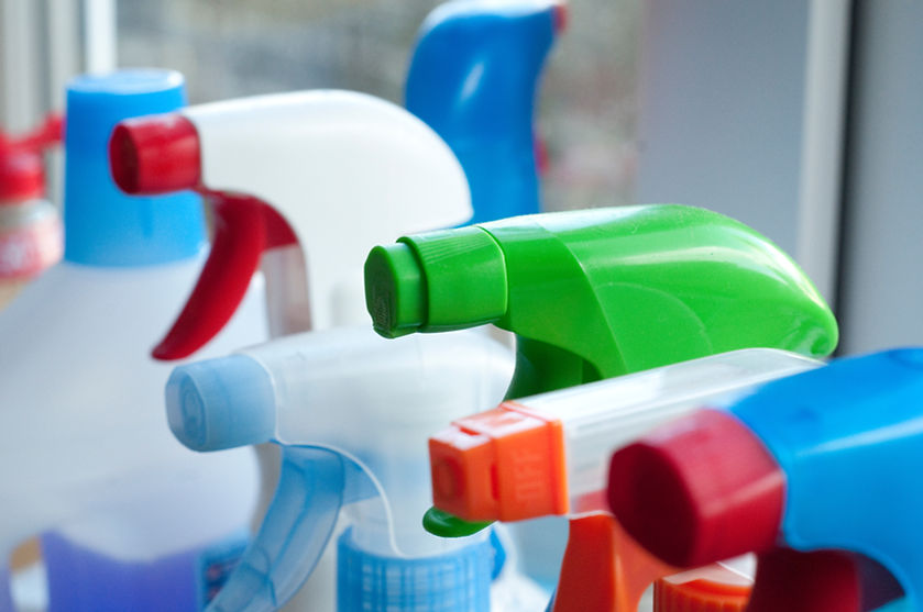 Close-Up Of Spray Bottles In Kitchen