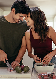 couple cooking together in their first home