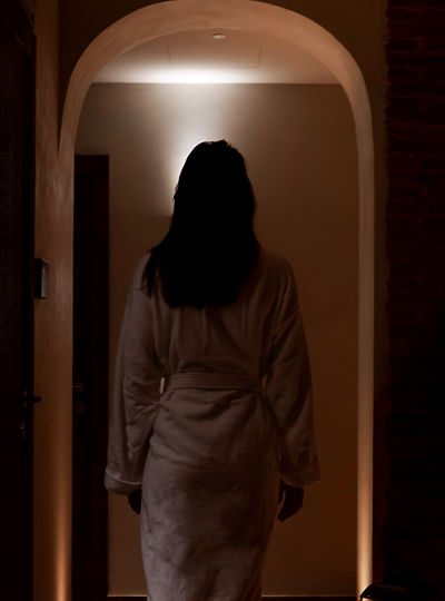 Woman in dim hallway