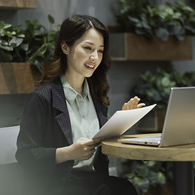 Asian woman having an online meeting on laptop