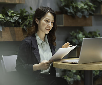 Asian woman having an online meeting on laptop