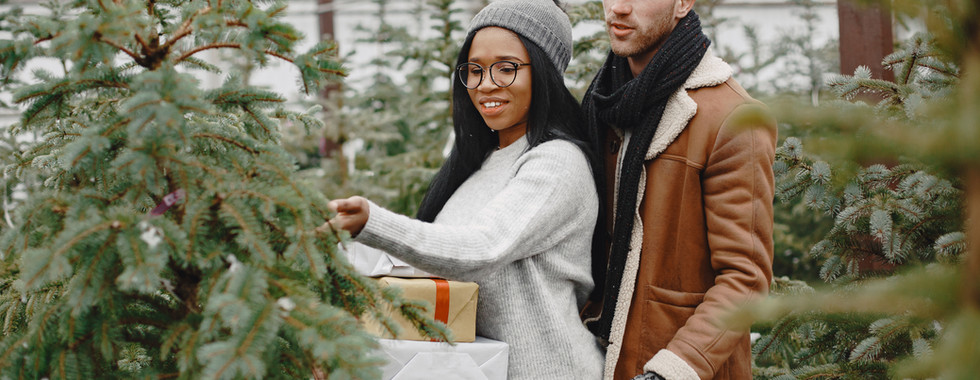 COUPLE PICKING OUT TREE