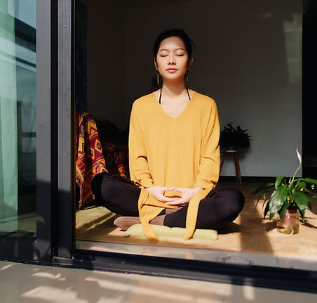 Woman Meditating Indoors