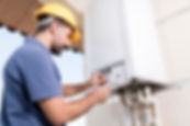 a technician inspecting a boiler