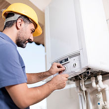 Boiler technician working in home