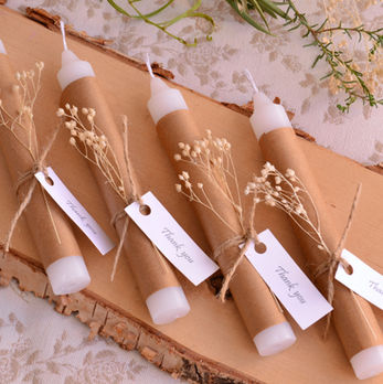 Handmade candles wrapped in kraft paper with thank you tags