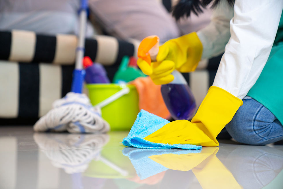 close-up image of a person's hand while cleaning floor