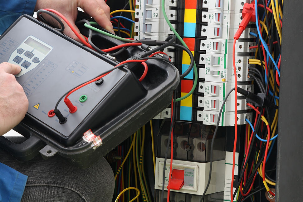 Electrician using a multimeter