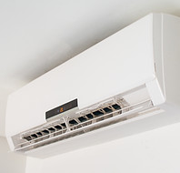 An air conditioner unit installed on a wall