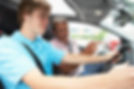 A driving instructor guiding a person