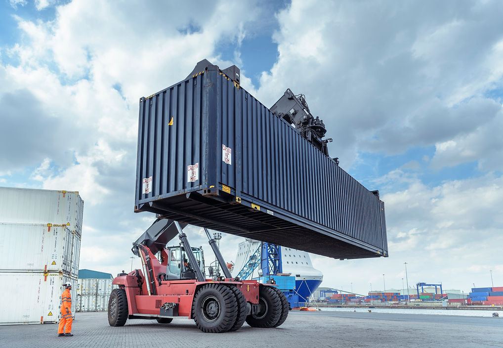 Container lift with shipping container in port