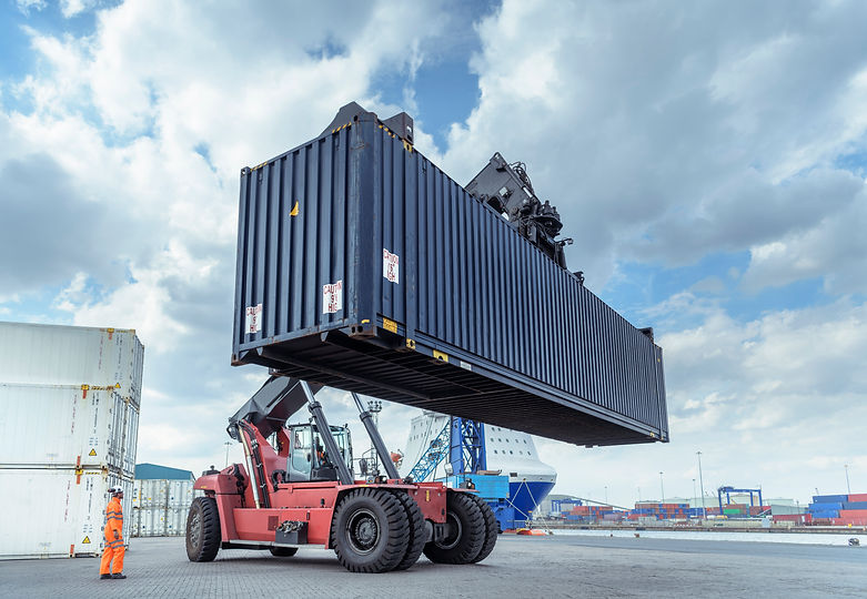 Container lift with shipping container in port