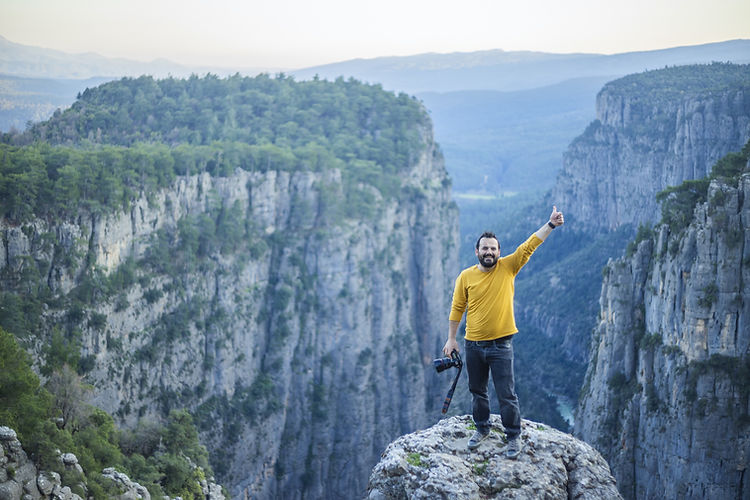 Posing on the Top of the Cliff
