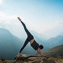 Woman doing yoga with mountain view