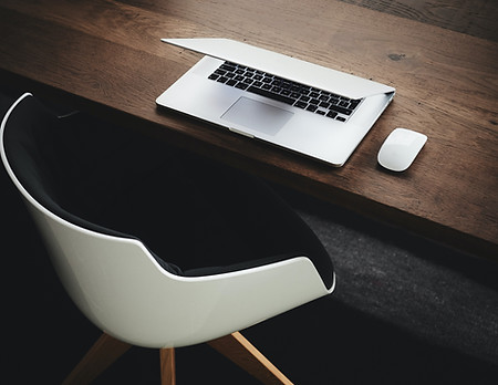 Table with laptop and chair