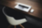 Table with laptop and chair