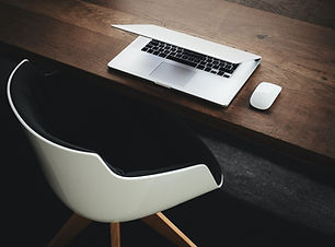 Table with laptop and chair