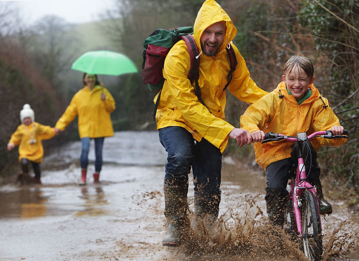 Family having fun in the Rain