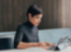 Businesswoman Using Tablet to Write SOP