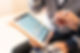 A man using a tablet to see a financial chart