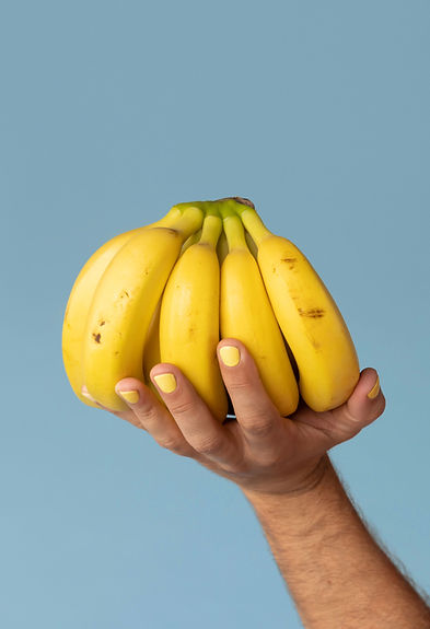 Hand Holding Bananas
