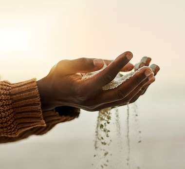 Hands Holding Sand