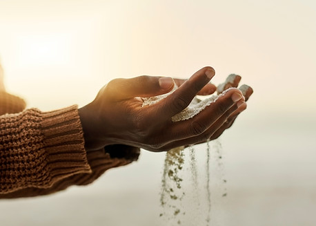 Hands Holding Sand