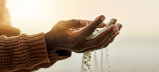 Hands Holding Sand