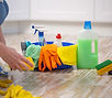 Woman with Cleaning Supplies