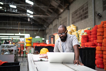 Factory Worker at Laptop