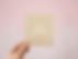 Woman holding card that reads "Love yourself."