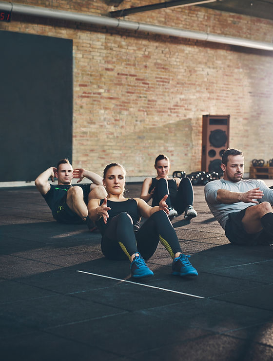 A photo showing multiple people doing core fitness