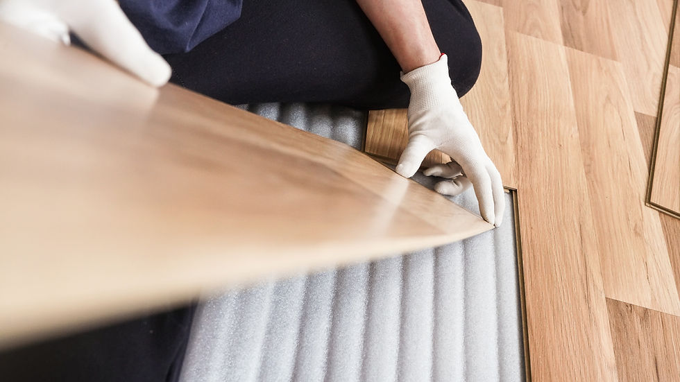 Specialist installing wood floor