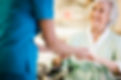 Nurse Holding Hands with Elderly Patient