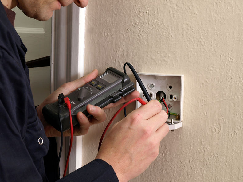 Electrician testing a switch