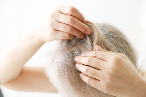 woman checking for hair loss