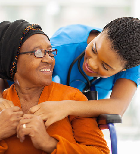 caregiver taking care of client in wheelchair