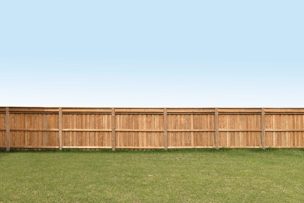 Fence at the end of a back yard,