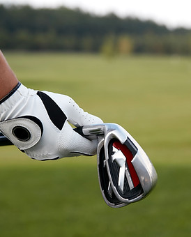 Holding Golf Clubs