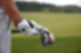 Holding Golf Clubs